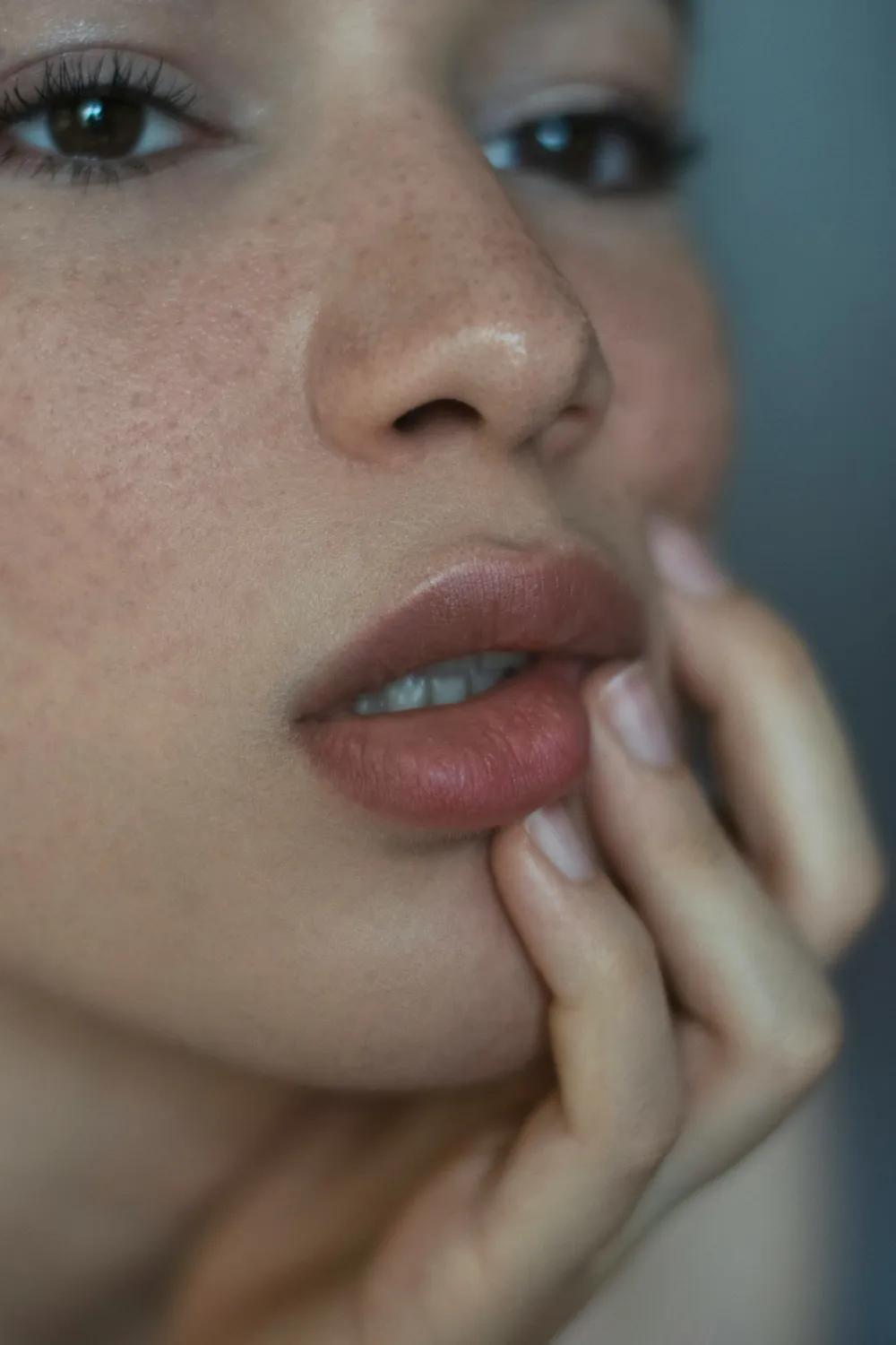 Natural lip shape on a freckled face with soft, understated definition