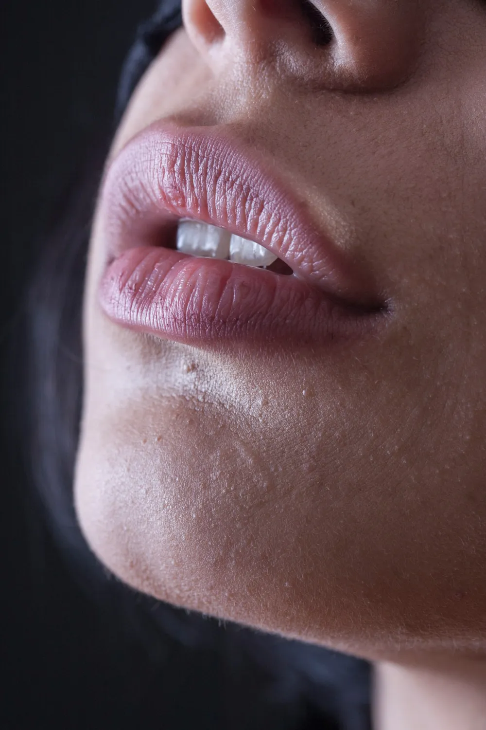 Slightly parted lips with subtle fullness and a smooth, rounded shape